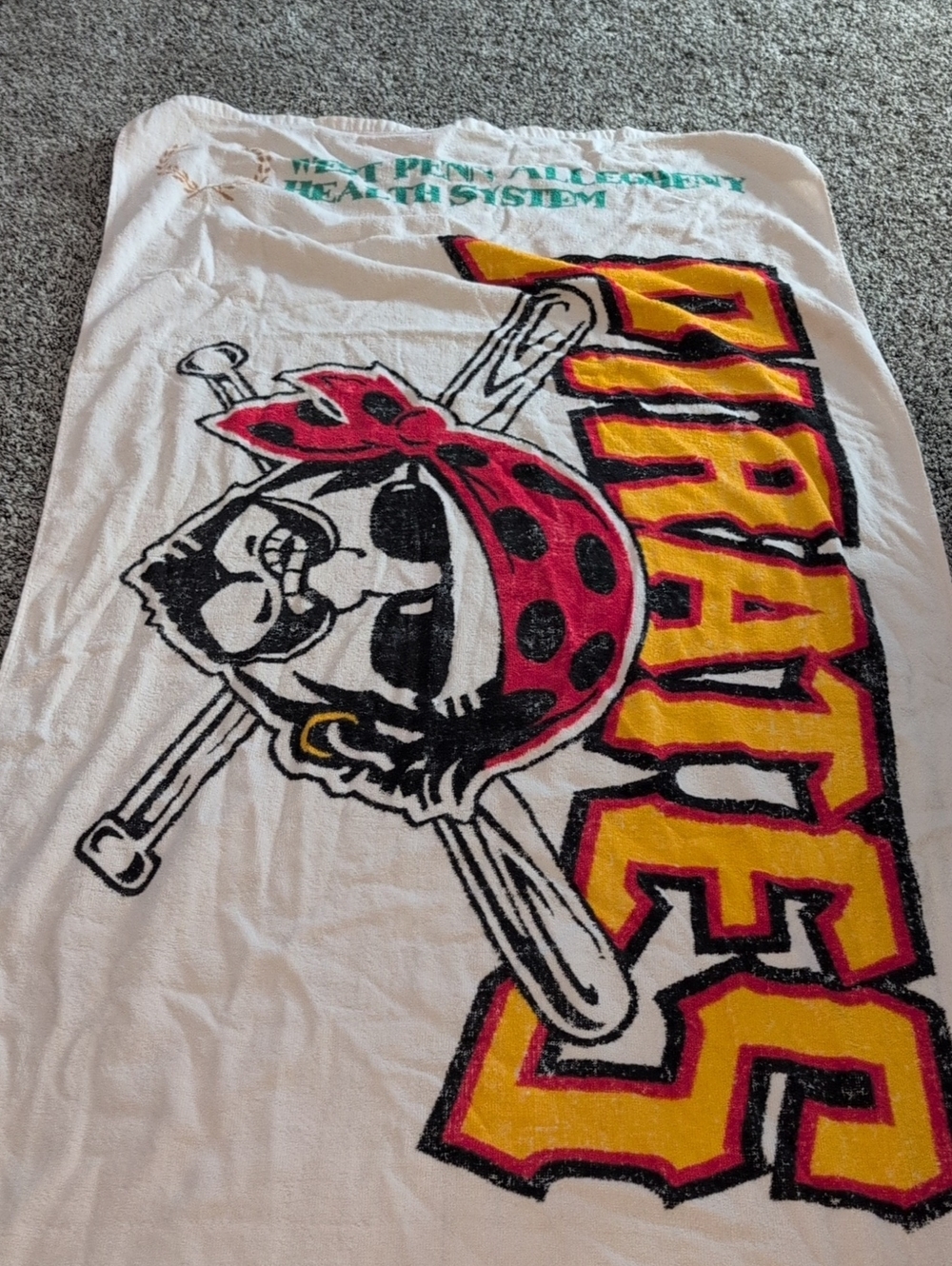 Pirates Graphic Beach Towel - Bold Yellow & Red Logo